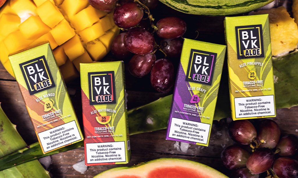 BLVK Aloe Salt E-liquid surrounded by fresh fruits